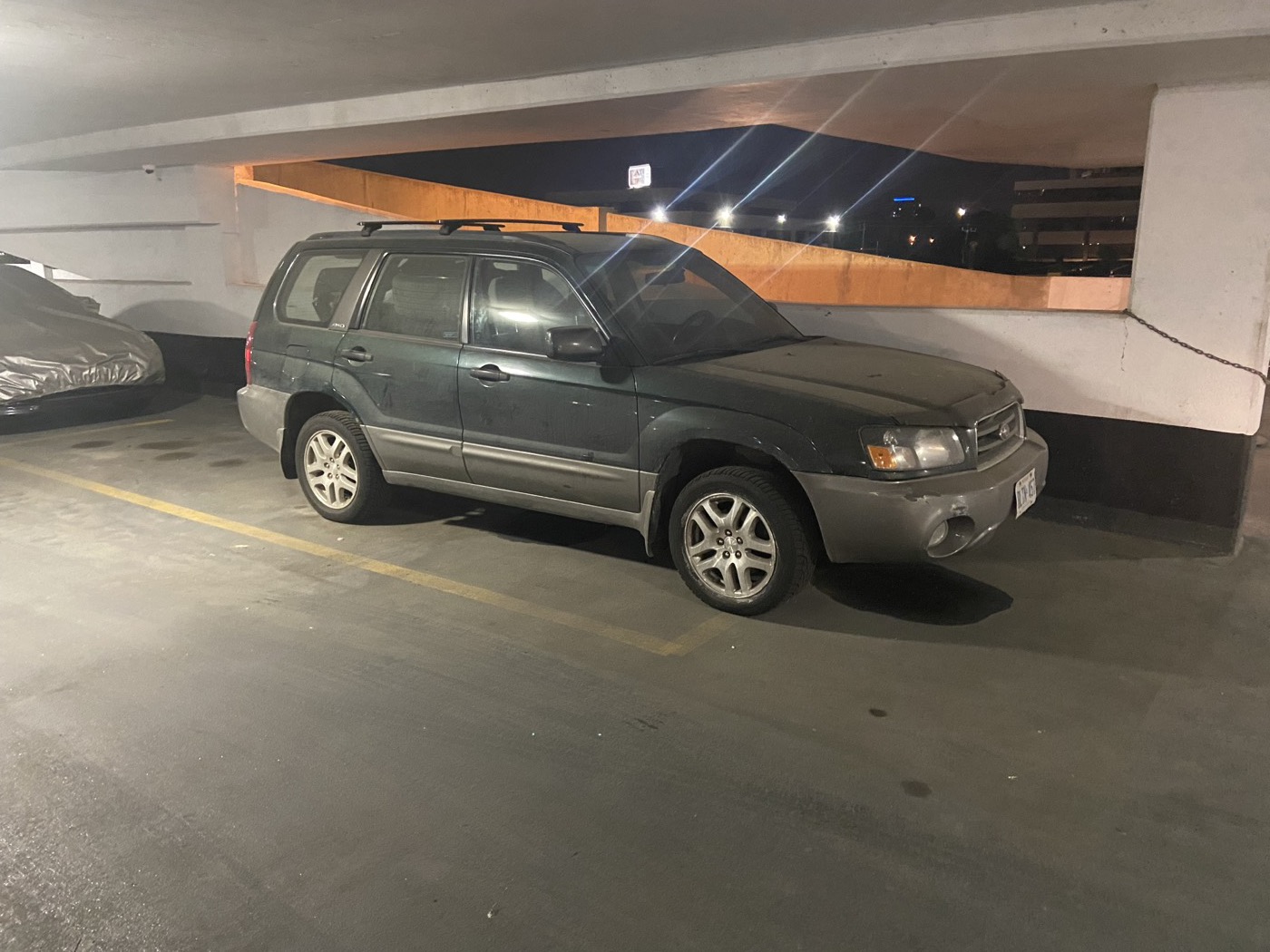 Green Forester XS in a parking garage
