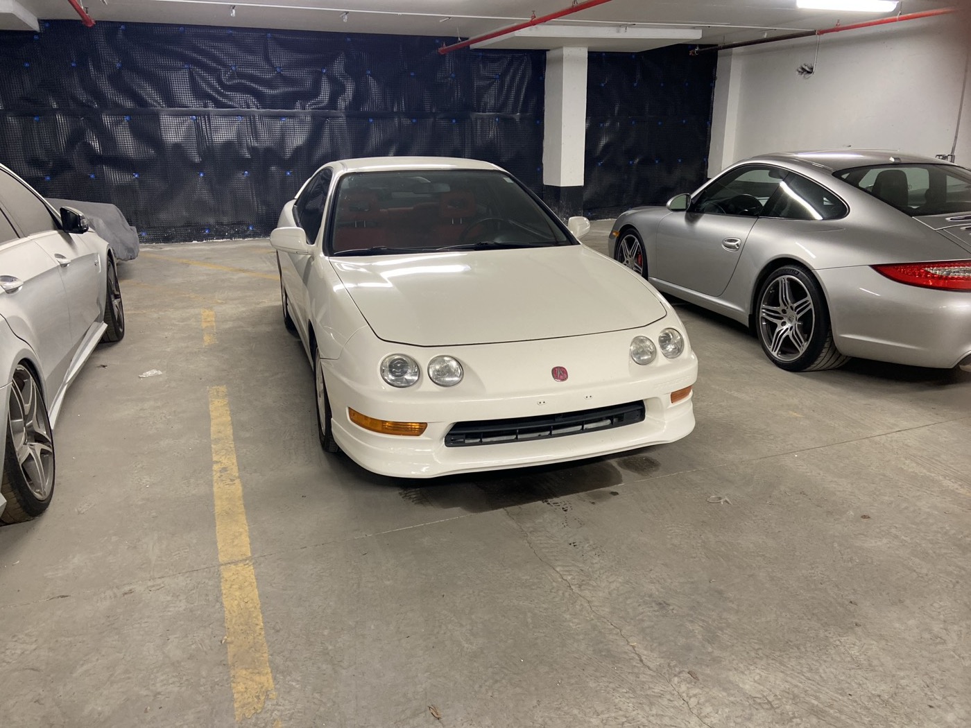 Championship White 2001 Acura Integra Type R in an underground garage