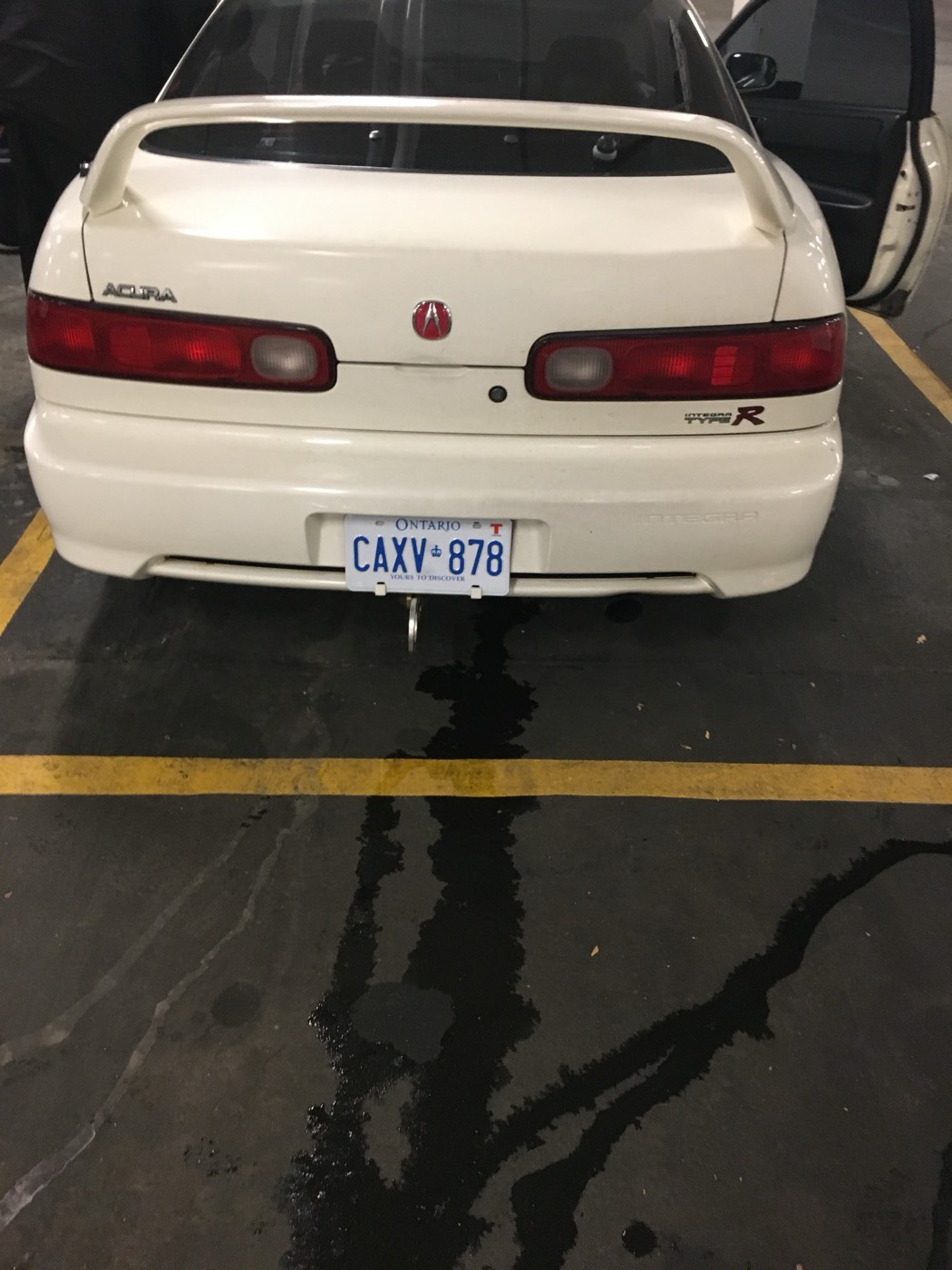 Rear of a white Integra Type R in an underground garage