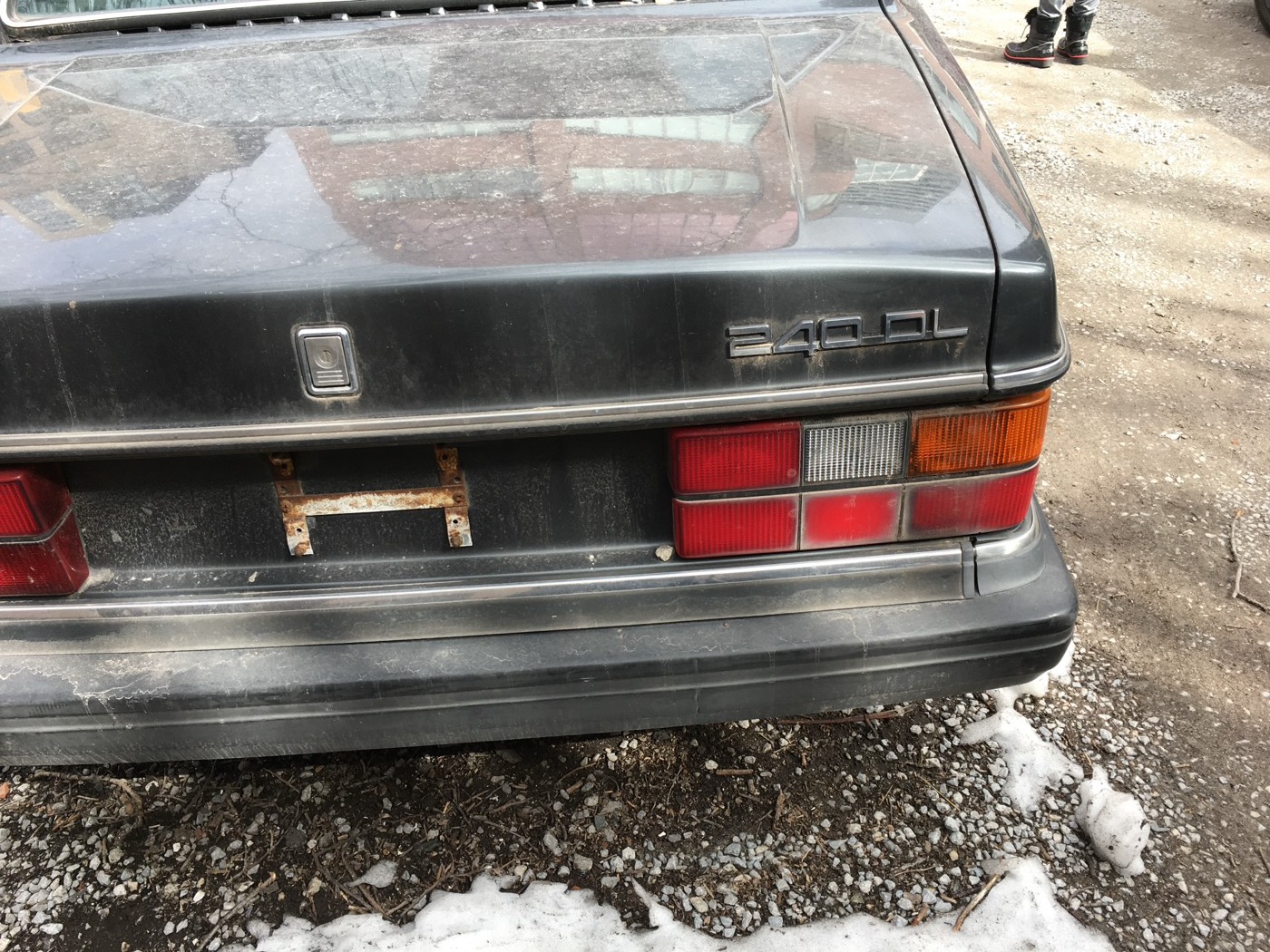 Rear of the grey Volvo 240 in snow